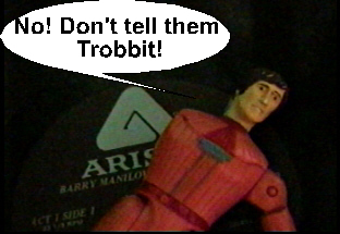 Adam tries to persuade Trobbit not to disclose the location of the transdimensional gateway.